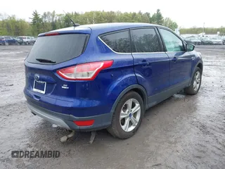 2015 Ford Escape SE z VIN 1FMCU9GX0FUB23447, wystawiony jako IAAI lot #42219379 z przebiegiem 113 274 mil mil oraz . Historia ofert i sprzedaży dostępna na DreamBid. Obrazek 4.