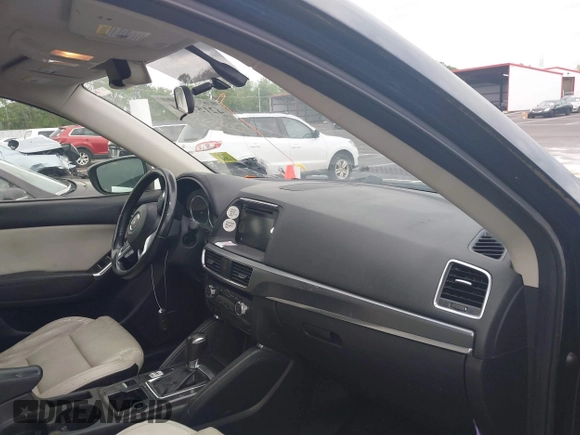 2016 Mazda CX-5 Grand Touring with VIN JM3KE2DYXG0890174, listed as a IAAI auction lot 42157884 with 141,873 mi miles. Bid and sale history available at carsss.com. Image 5.