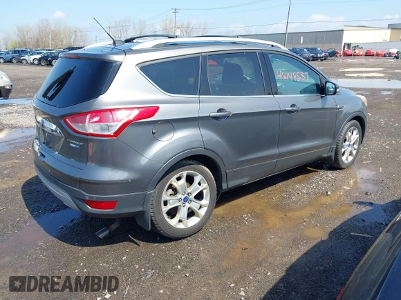 2014 Ford Escape Titanium with VIN 1FMCU9J99EUA75276, listed as a IAAI auction lot 42148537 with 163,330 mi miles and . Bid and sale history available at DreamBid. Image 4.