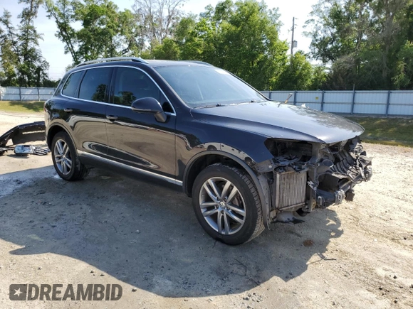 2015 Volkswagen Touareg Lux с VIN WVGEP9BP4FD004212, выставлен на аукционе Copart как лот 54021345 с пробегом 156 164 миль миль и Списание • Salvage title. История ставок и продаж доступна на DreamBid. Изображение 4.