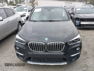 2018 BMW X1 xDrive28i with VIN WBXHT3C34J5K21576, listed as a IAAI auction lot 41822390 with 69,645 mi miles. Bid and sale history available at carsss.com. Image 12.