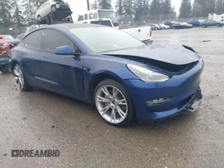 2022 Tesla Model 3 Long Range with VIN 5YJ3E1EB1NF142574, listed as a IAAI auction lot 41213900 with 127,404 mi miles. Bid and sale history available at carsss.com. Image 1.