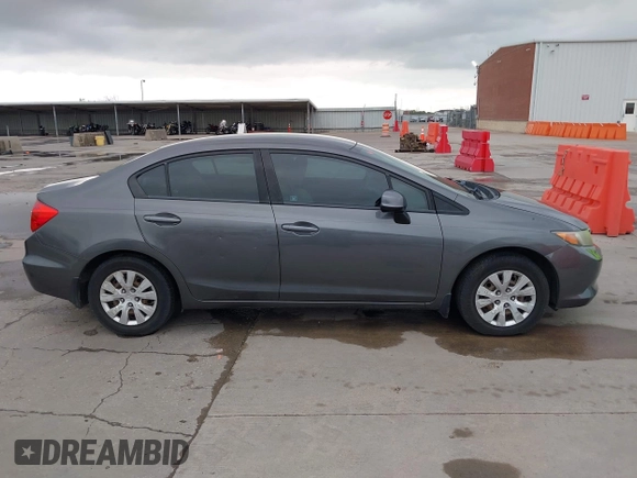 2012 Honda Civic LX z VIN 2HGFB2F51CH600546, wystawiony jako IAAI lot #41920265 z przebiegiem 196 599 mil mil oraz . Historia ofert i sprzedaży dostępna na DreamBid. Obrazek 13.