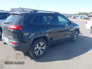 2015 Jeep Cherokee Trailhawk with VIN 1C4PJMBS4FW556822, listed as a IAAI auction lot 42412874 with 129,865 mi miles and . Bid and sale history available at DreamBid. Image 4.