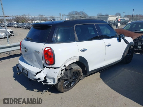 2014 MINI Countryman S with VIN WMWZC3C52EWP25060, listed as a IAAI auction lot 41642855 with 240,396 mi miles and . Bid and sale history available at DreamBid. Image 4.