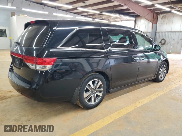 2015 Honda Odyssey Touring Elite with VIN 5FNRL5H99FB005576, listed as a Copart auction lot 58963215 with 167,967 mi miles and Salvage title. Bid and sale history available at DreamBid. Image 3.