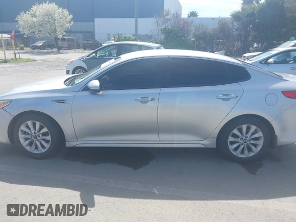 2018 Kia Optima LX with VIN 5XXGT4L31JG267716, listed as a IAAI auction lot 41890611 with 63,491 mi miles and . Bid and sale history available at carsss.com. Image 14.
