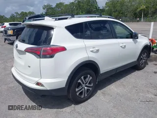 2016 Toyota RAV4 LE with VIN JTMZFREV2GJ096782, listed as a IAAI auction lot 41945319 with 76,866 mi miles. Bid and sale history available at carsss.com. Image 4.