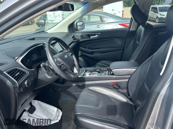 2020 Ford Edge Titanium z VIN 2FMPK3K95LBA30633, wystawiony jako IAAI lot #42473515 z przebiegiem 104 190 mil mil oraz . Historia ofert i sprzedaży dostępna na DreamBid. Obrazek 9.