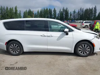 2023 Chrysler Pacifica Hybrid Touring L with VIN 2C4RC1L77PR541513, listed as a IAAI auction lot 42433421 with 53,979 mi miles and . Bid and sale history available at DreamBid. Image 14.
