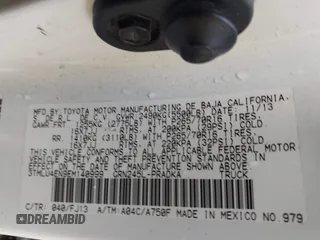 2014 Toyota Tacoma with VIN 3TMLU4EN9EM140999, listed as a IAAI auction lot 37765514 with 168,875 mi miles. Bid and sale history available at carsss.com. Image 9.