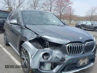 2019 BMW X1 xDrive28i with VIN WBXHT3C51K5L90571, listed as a IAAI auction lot 41909209 with 35,902 mi miles. Bid and sale history available at carsss.com. Image 1.