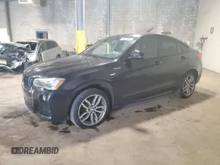 2015 BMW X4 xDrive28i with VIN 5UXXW3C52F0M86520, listed as a Copart auction lot 65878665 with 89,715 mi miles and Salvage title. Bid and sale history available at DreamBid. Image 1.