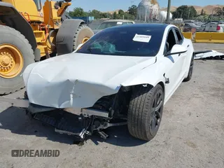 2023 Tesla Model S with VIN 5YJSA1E59PF500816, listed as a IAAI auction lot 42409049 with Not provided miles and . Bid and sale history available at DreamBid. Image 6.