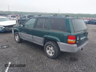 1996 Jeep Grand Cherokee Laredo with VIN 1J4GZ58S6TC333856, listed as a IAAI auction lot 42504895 with 176,955 mi miles and . Bid and sale history available at DreamBid. Image 3.