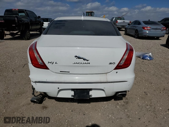 2014 Jaguar XJ with VIN SAJWA2GZ3E8V70365, listed as a Copart auction lot 42545995 with 65,649 mi miles and Salvage Title. Bid and sale history available at carsss.com. Image 6.