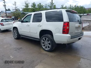 2013 Chevrolet Tahoe LT with VIN 1GNSKBE05DR293054, listed as a IAAI auction lot 41955877 with 192,474 mi miles and . Bid and sale history available at DreamBid. Image 3.