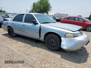 2004 Ford Crown Victoria LX z VIN 2FAFP74W54X184815, wystawiony jako Copart lot #57280725 z przebiegiem 294 513 mil mil oraz Szkoda całkowita • Salvage title. Historia ofert i sprzedaży dostępna na DreamBid. Obrazek 4.