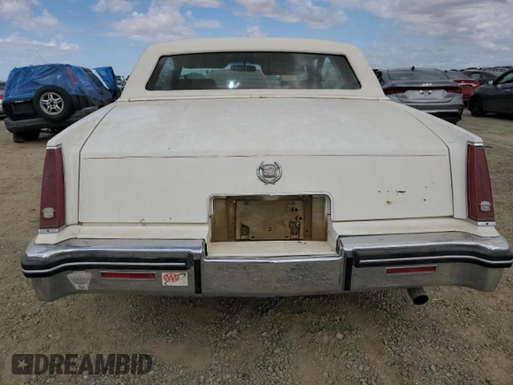1984 Cadillac Eldorado z VIN 1G6AL5782EE603047, wystawiony jako Copart lot #76777394 z przebiegiem 33 384 mil mil oraz Czysty tytuł • Clean title. Historia ofert i sprzedaży dostępna na DreamBid. Obrazek 6.