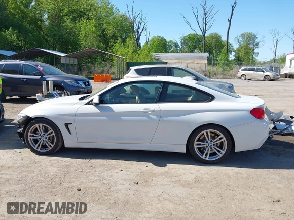 2014 BMW 4 Series 435i z VIN WBA3R1C51EK192103, wystawiony jako IAAI lot #42127351 z przebiegiem 99 023 mil mil oraz . Historia ofert i sprzedaży dostępna na DreamBid. Obrazek 14.
