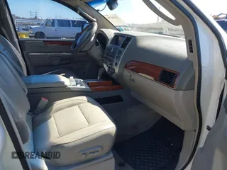 2010 Infiniti QX56 with VIN 5N3ZA0NE7AN909000, listed as a IAAI auction lot 42044598 with 284,698 mi miles. Bid and sale history available at carsss.com. Image 5.