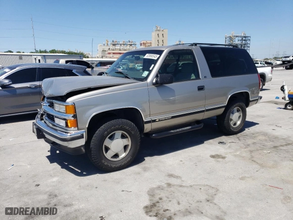 1999 Chevrolet Tahoe with VIN 3GNEK18RXXG190783, listed as a Copart auction lot 52666545 with 240,094 mi miles and Salvage Title. Bid and sale history available at carsss.com. Image 1.