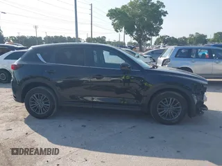 2020 Mazda CX-5 Touring with VIN JM3KFACM2L0770241, listed as a IAAI auction lot 42186952 with 41,590 mi miles and . Bid and sale history available at DreamBid. Image 14.