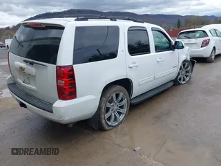 2013 Chevrolet Tahoe LT with VIN 1GNSKBE05DR293054, listed as a IAAI auction lot 41955877 with 192,474 mi miles and . Bid and sale history available at DreamBid. Image 4.