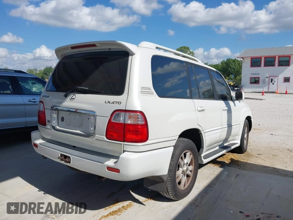 2003 Lexus LX 470 with VIN JTJHT00WX33523623, listed as a IAAI auction lot 42028889 with 317,700 mi miles and . Bid and sale history available at DreamBid. Image 4.