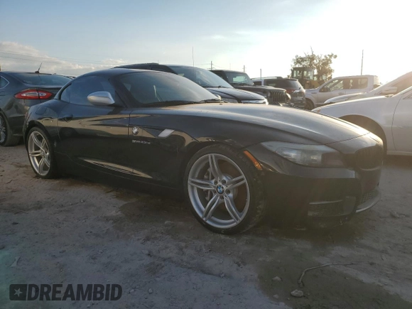 2011 BMW Z4 sDrive35is with VIN WBALM1C56BE633331, listed as a Copart auction lot 73922324 with Not provided miles and Salvage title. Bid and sale history available at DreamBid. Image 4.