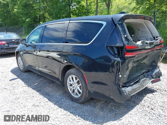 2023 Chrysler Pacifica Touring L with VIN 2C4RC1BG2PR534194, listed as a IAAI auction lot 42613934 with 69,896 mi miles and . Bid and sale history available at DreamBid. Image 3.