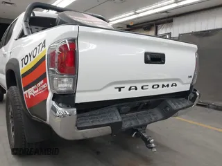 2022 Toyota Tacoma SR with VIN 3TMCZ5AN5NM480311, listed as a IAAI auction lot 42542600 with 43,297 mi miles and . Bid and sale history available at DreamBid. Image 6.