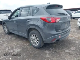 2015 Mazda CX-5 Touring with VIN JM3KE2CY2F0461935, listed as a IAAI auction lot 41430070 with 220,857 mi miles and . Bid and sale history available at carsss.com. Image 3.