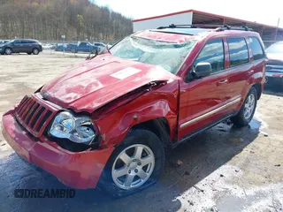 2010 Jeep Grand Cherokee Laredo with VIN 1J4PR4GK9AC143199, listed as a IAAI auction lot 41972153 with 81,896 mi miles. Bid and sale history available at carsss.com. Image 2.