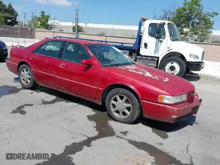 1996 Cadillac Seville Touring STS with VIN 1G6KY5290TU835414, listed as a IAAI auction lot 42051767 with 185,798 mi miles. Bid and sale history available at carsss.com. Image 1.