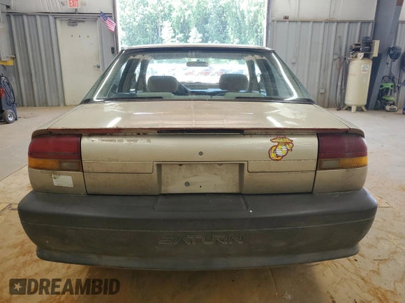 1995 Saturn SL with VIN 1G8ZH5280SZ302560, listed as a Copart auction lot 63290495 with 123,475 mi miles and Clean title. Bid and sale history available at DreamBid. Image 6.