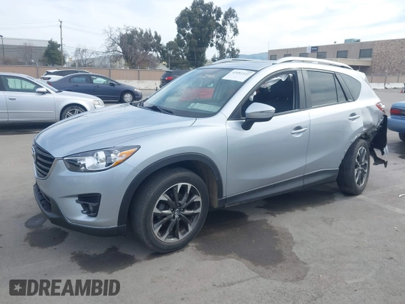 2016 Mazda CX-5 Grand Touring with VIN JM3KE2DY9G0723921, listed as a IAAI auction lot 41681522 with 83,893 mi miles. Bid and sale history available at carsss.com. Image 2.