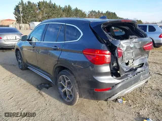 2018 BMW X1 xDrive28i with VIN WBXHT3C33J5F90349, listed as a IAAI auction lot 41385063 with 55,994 mi miles. Bid and sale history available at carsss.com. Image 3.