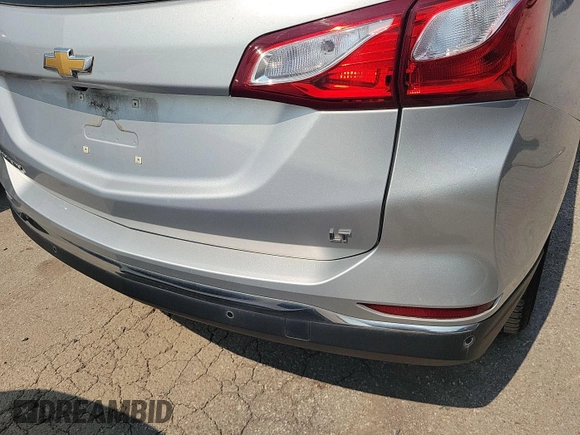 2021 Chevrolet Equinox LT z VIN 3GNAXJEV9ML393765, wystawiony jako IAAI lot #42561470 z przebiegiem 68 765 mil mil oraz . Historia ofert i sprzedaży dostępna na DreamBid. Obrazek 3.