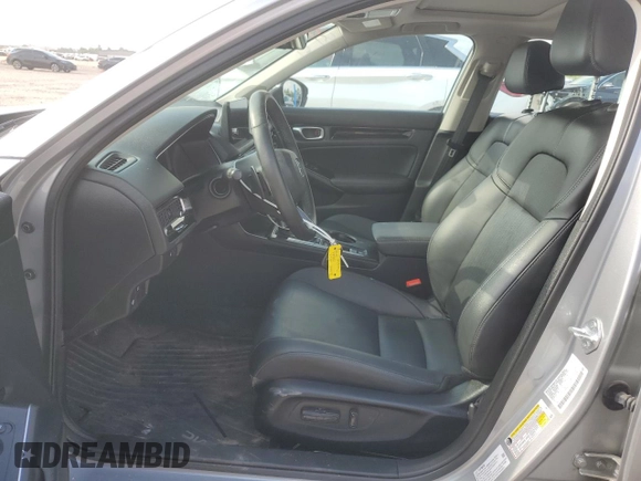 2023 Honda Civic Touring z VIN 2HGFE1F92PH323562, wystawiony jako Copart lot #54060205 z przebiegiem 20 504 mil mil oraz Czysty tytuł • Clean title. Historia ofert i sprzedaży dostępna na DreamBid. Obrazek 7.