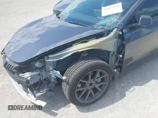 2023 Tesla Model 3 with VIN 5YJ3E1EAXPF575448, listed as a IAAI auction lot 42019288 with 33,859 mi miles and . Bid and sale history available at carsss.com. Image 6.