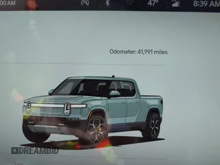 2022 Rivian R1T Adventure z VIN 7FCTGAAA5NN007018, wystawiony jako IAAI lot #42018939 z przebiegiem 41 991 mil mil oraz . Historia ofert i sprzedaży dostępna na DreamBid. Obrazek 7.