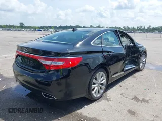 2013 Hyundai Azera z VIN KMHFH4JG0DA310957, wystawiony jako IAAI lot #42451780 z przebiegiem 82 827 mil mil oraz . Historia ofert i sprzedaży dostępna na DreamBid. Obrazek 4.