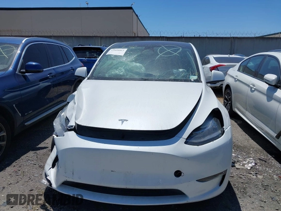 2022 Tesla Model Y Long Range with VIN 7SAYGDEE8NF480939, listed as a IAAI auction lot 41808863 with 62,607 mi miles and . Bid and sale history available at carsss.com. Image 13.