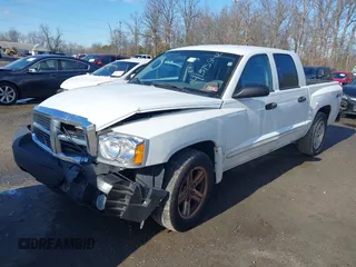 2007 Dodge Dakota SLT z VIN 1D7HW48JX7S166780, wystawiony jako IAAI lot #41375942 z przebiegiem 148 778 mil mil oraz . Historia ofert i sprzedaży dostępna na DreamBid. Obrazek 2.