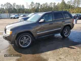 2006 Jeep Grand Cherokee Laredo with VIN 1J4HS48N96C357909, listed as a Copart auction lot 77551154 with 136,235 mi miles and Salvage Title. Bid and sale history available at carsss.com. Image 1.