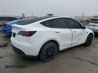 2023 Tesla Model Y Long Range z VIN 7SAYGDEE7PA102174, wystawiony jako Copart lot #49904435 z przebiegiem 144 702 mil mil oraz Szkoda całkowita • Salvage title. Historia ofert i sprzedaży dostępna na DreamBid. Obrazek 3.