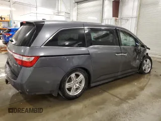 2012 Honda Odyssey Touring with VIN 5FNRL5H98CB028309, listed as a Copart auction lot 57663485 with 233,921 mi miles and Salvage title. Bid and sale history available at DreamBid. Image 3.