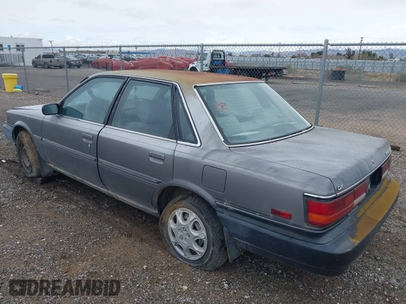 1990 Toyota Camry DLX z VIN 4T1SV21EXLU271320, wystawiony jako IAAI lot #41798353 z przebiegiem 269 178 mil mil oraz . Historia ofert i sprzedaży dostępna na DreamBid. Obrazek 3.