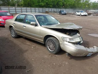 2000 Mercury Grand Marquis GS z VIN 2MEFM74W3YX689355, wystawiony jako IAAI lot #42107909 z przebiegiem 100 364 mil mil oraz . Historia ofert i sprzedaży dostępna na DreamBid. Obrazek 1.